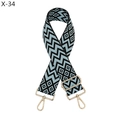 Detail of blue and black jacquard woven diamond pattern strap with gold metal hooks - Silver Clasp / Blue and Black Geometric Jacquard (X-34)