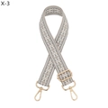 Detailed view of grey and beige geometric woven wide shoulder strap with gold metal hooks - Grey (X-3)