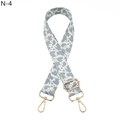 Detail of adjustable cow print bag strap with high-density webbing and gold metal lobster clasps - Gray Cow Pattern Silver Buckle (N-4)