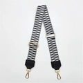 Close-up of adjustable PU leather bag strap with black and white geometric wave patterns - No.5 Woven Black & White