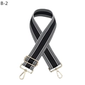 Close-up of adjustable black and white striped bag strap with gold metal lobster clasps - Black (B-2)