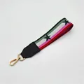 Detail of colorful striped handbag strap with black stars and gold spring hook - No.2 Multicolor Star