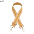 Detail of adjustable orange and white striped bag strap with gold metal buckle - Gold Buckle / Yellow