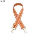 Detail of adjustable orange nylon bag strap with white stripes and light gold hardware - Gold Buckle / Orange
