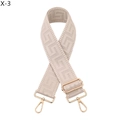 Detail of beige geometric jacquard strap with gold adjustable buckle and swivel hooks - Silver Clasp / Beige
