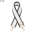 Close-up of white fabric bag strap with black trim and gold-tone adjustable metal buckles - White with Black Edge