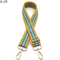 Detail view of woven diamond pattern bag strap with gold metal hooks and adjustable buckle - Yellow Green (A-29)