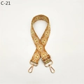 Close-up of orange and white diamond pattern wide adjustable strap with gold metal hardware - C-21 Yellow