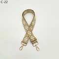 Detail of adjustable geometric diamond pattern bag strap with gold metal buckles - C-22 Gold Wire Khaki