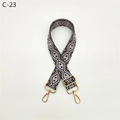 Detail of adjustable woven bag strap with geometric diamond pattern and gold metal hooks - C-23 Dark Purple