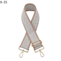 Detail of adjustable wide woven shoulder strap with gold-tone hardware and Greek key pattern - Gray with Pink Edge (X-35)