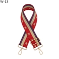 Detail van een brede etnische tasriem met gouden sterren en rood-paarse strepen - W-13 Paars Rood Ster / Zilveren Sluiting