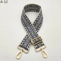 Detail of widened geometric jacquard bag strap with gold metal swivel snap hooks - Blue Gold Buckle (A-12)
