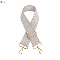 Close-up of geometric jacquard bag strap with silver diamond patterns and gold hooks - Off White (Gold Buckle)