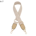 Macro detail of adjustable jacquard bag strap with golden buckles and F-pattern design - Beige and Khaki Leather (A-7)