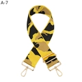 Detailed view of wide camo nylon bag strap with polished gold-tone metal lobster clasps - Yellow (A-7)