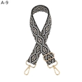 Close-up of woven geometric diamond pattern bag strap with gold metal lobster clasps - Black (A-9)