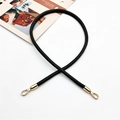 Close-up of black PU leather handbag strap with light gold lobster clasps on white surface - Army Green