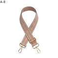 Detail view of pink chevron woven bag strap with golden metal lobster hooks and buckle - Pink