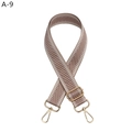 Detail of adjustable nylon bag strap with herringbone pattern and gold-tone metal hooks - Flesh Pink