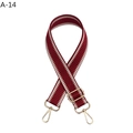Close-up of red and white woven adjustable shoulder strap with gold-tone hooks - Burgundy