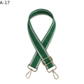 Detail of adjustable green and white wavy pattern bag strap with gold metal hardware - Green