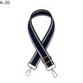 Close-up of dark blue and beige wavy woven strap with golden lobster clasps - Blue
