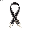 Detail showing high-density black and white herringbone woven strap with gold metal hooks - Black
