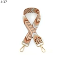 Close-up of bohemian geometric woven replacement bag strap with golden metal lobster clasps - Brown