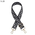 Close-up of adjustable woven bag strap with black and white geometric jacquard and gold hardware - Black (S-20)
