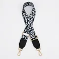 Detail of adjustable leopard print bag strap with black leather ends and gold metal hooks - Black Light Blue Leopard