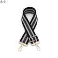 Macro shot of wide woven bag strap with arrow pattern and gold metal buckles - A-3 Black