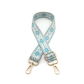 Close-up of adjustable blue snowflake woven strap with golden metal lobster clasps - Lake Blue