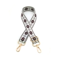Detail of adjustable star pattern bag strap with gold rotating metal hooks and buckles - Gold Buckle / Brown