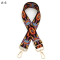 Close-up of geometric jacquard bag strap with gold metal swiveling hooks and adjustable buckle - A-6 Black Red Blue