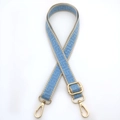 Close-up of sky blue geometric woven bag strap with premium gold metal hardware hooks - Light Blue