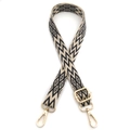 Detail of adjustable black and white geometric canvas bag strap with gold metal hooks - Khaki & Black