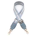 Detail view of light blue adjustable PU leather shoulder strap with silver metallic stripes - Light Blue