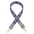 Detail of adjustable woven bag strap with navy and white geometric jacquard pattern - Gold Buckle / Blue