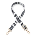 Close-up of geometric black and white woven bag strap with golden metal swivel hooks - Gold Buckle / Black & White