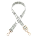 Close-up of bohemian green and white geometric bag strap with gold metal hooks - Matcha Green