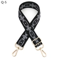 Detailed view of ethnic embroidery bag strap with gold metal hooks and adjustable buckle - Silver Clasp / Q-5 Black White