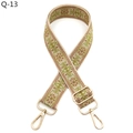 Detailed close-up of ethnic embroidered floral bag strap with metal lobster clasps - Khaki Brown Light Green