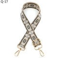Close-up of ethnic style adjustable bag strap with black and white floral woven pattern - Khaki & Black