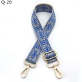 Close-up of ethnic blue geometric pattern bag strap with gold metal lobster clasps - Lake Blue