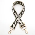 Close-up of geometric jacquard adjustable bag strap with light gold metal hardware - No.12 Khaki Black White (Geometric Jacquard)