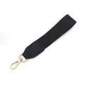 Detail of black woven strap with gold metal lobster clasp and premium leather reinforcement - Wristlet + Gold Hardware