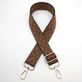 Detail of adjustable woven shoulder strap with geometric pattern and gold swivel clips - Silver Clasp / Black Brown