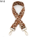 Detail of adjustable geometric jacquard shoulder strap with gold metal lobster clasps - M-8 Brown