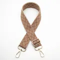 Close-up of brown and beige geometric woven bag strap with golden metal swivel hooks - Silver Clasp / Brown (No. 30) / [product Attributes] This Product Is A [geometric Woven Bag Strap] Visually Estimated To Be Made Of Polyester-cotton Or Thickened Woven Material With A [brown And Beige] Woven Geometric Pattern On The Surface. The Accessories Are Made Of [gold-plated Metal] Material Including Two 360-degree Rotating Hooks And A Length Adjustment Buckle With A Simple And Elegant Design. [visual Presentation] The Image Uses A Standard [overhead Flat Lay] Composition With The Product Placed In A Crisscross Pattern Against A Pure White Background. Image Quality Is [high] With Accurate Focus And Realistic Reproduction Of Fabric Texture And Metallic Sheen. Aesthetics Are [medium] With An Overall Score Of [7.5]. The White Background Image Presentation Is Average Lacking A Certain Emotional Impact. [text Content] The To_remove Team Identified The Floating Text "30" In The Upper Left Corner Which Is Determined To Be An Internal B-end Product Number Identifier And Needs To Be Removed. There Are No Other Texts Requiring Translation Or Restricted Text. [logistics Tags] None [infringement Risk] Product Infringement: None As It Is A General Bag Strap Accessory Design With No Brand Logo Or Specific Copyrighted Pattern Observed. Background Infringement: None. 【product Parameters】product Serial Number/item Number: 30.